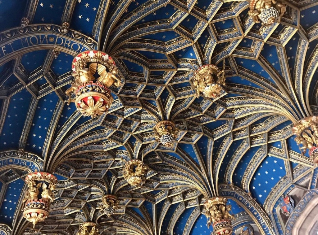 Blue and gold ornate decorated ceiling at Hampton court palace. 